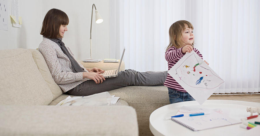 Woman using laptop on couch